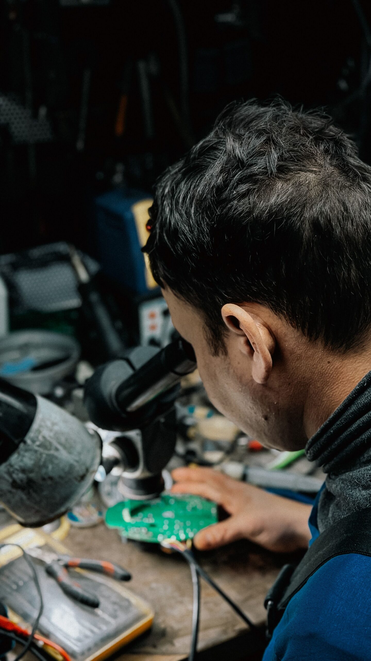 Illustrative stock photograph of electronics inspection with a microscope